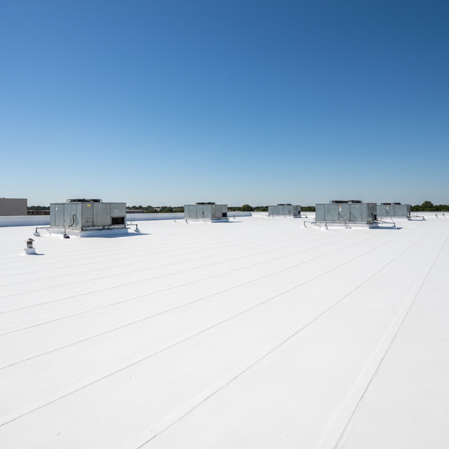 White TPO commercial flat roof membrane on an Effingham business building